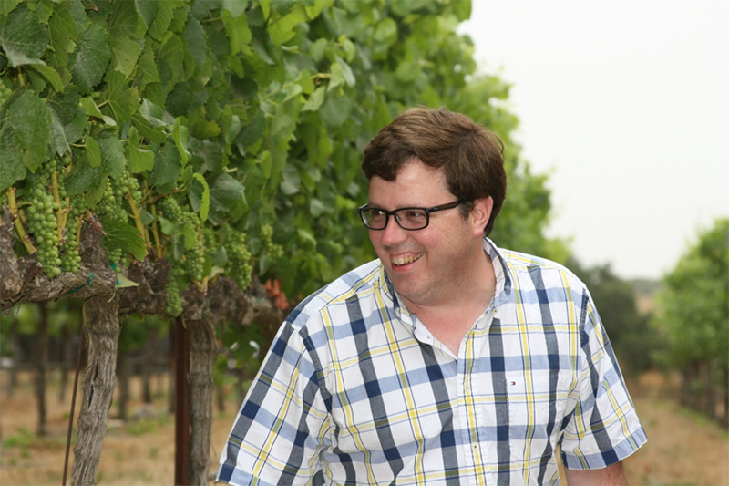 Adam Lee in vineyard