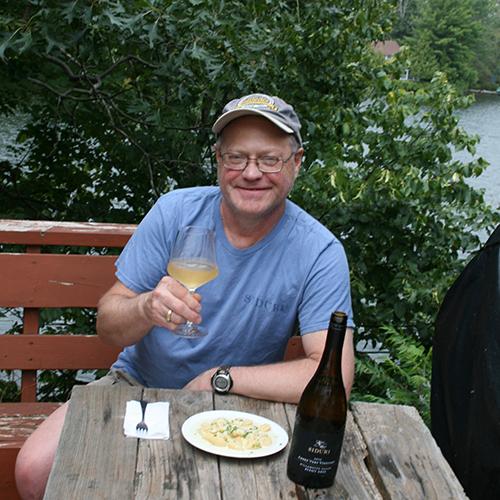 Tim Soberick drinking Siduri on a deck